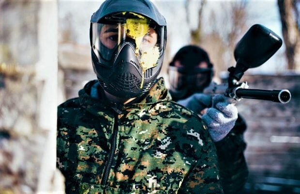 paintball player in splattered mask, front view