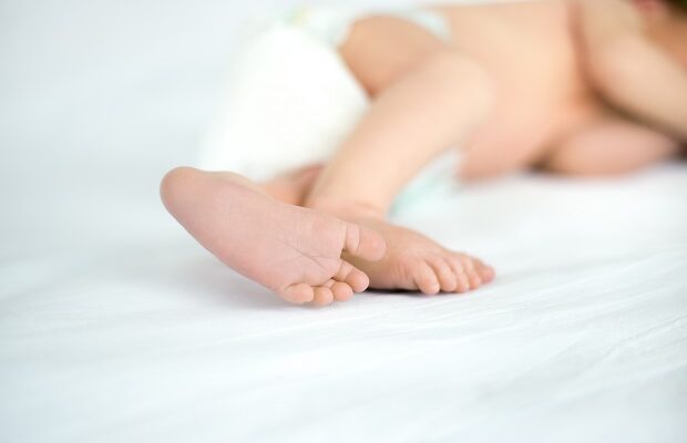 close up of feet of sleeping infant
