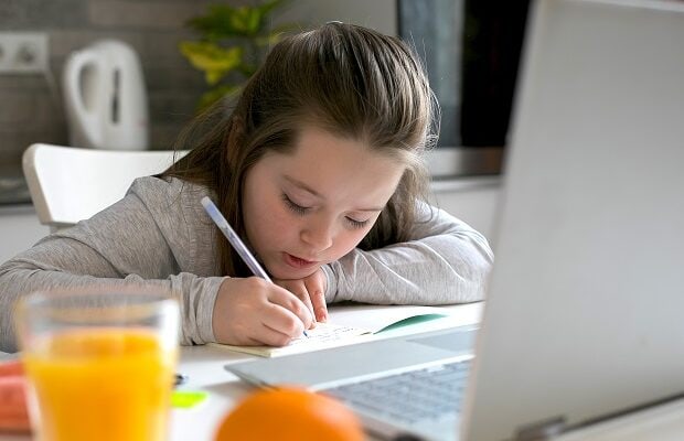 pretty girl studying at home. home school, online home education, quarantine, coronavirus concept