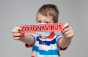 young child wearing a respiratory mask as a prevention against the coronavirus covid 19