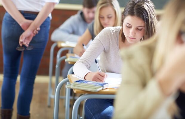 students in classroom having an exam