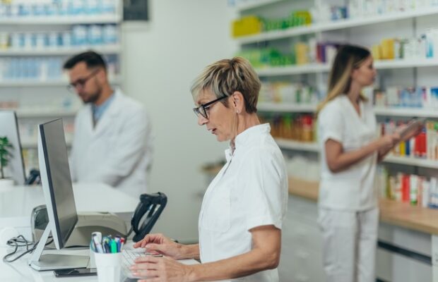 senior female pharmacist working in a pharmacy
