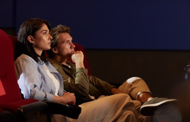 side view of couple in cinema