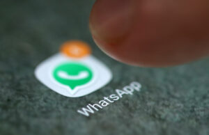 the whatsapp app logo is seen on a smartphone in this illustration