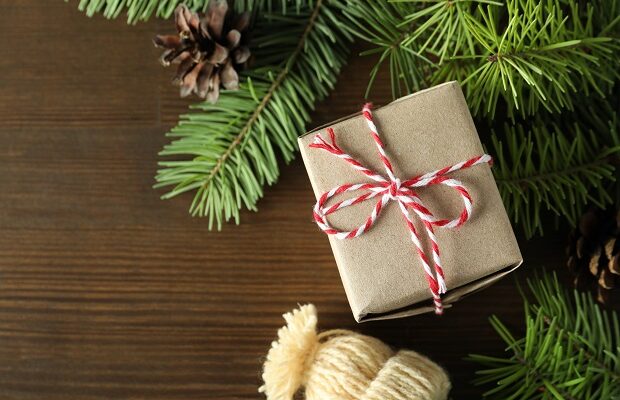 christmas concept with gift on wooden background