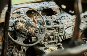 burned car interior close up, vehicle fire damaged motor vehicle, car fire