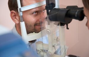 confident male is receiving qualified consultation in ophthalmology clinic