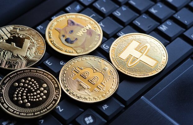 various cryptocurrencies and laptop