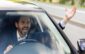 close up photo of an angry young businessman driving a car, shouting and waving his hands