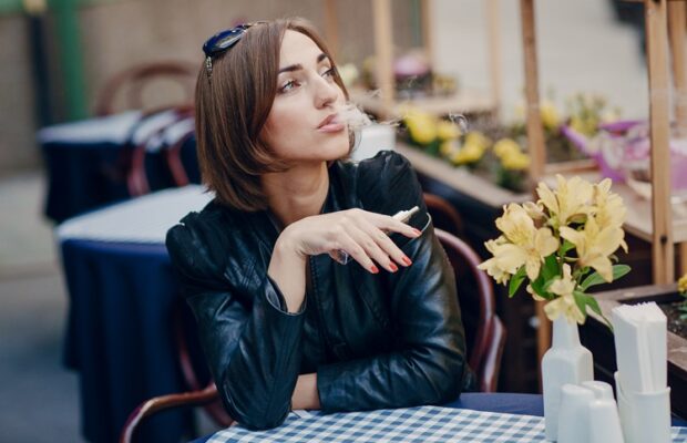 beautiful glamorous brunette smoke electronic cigarette